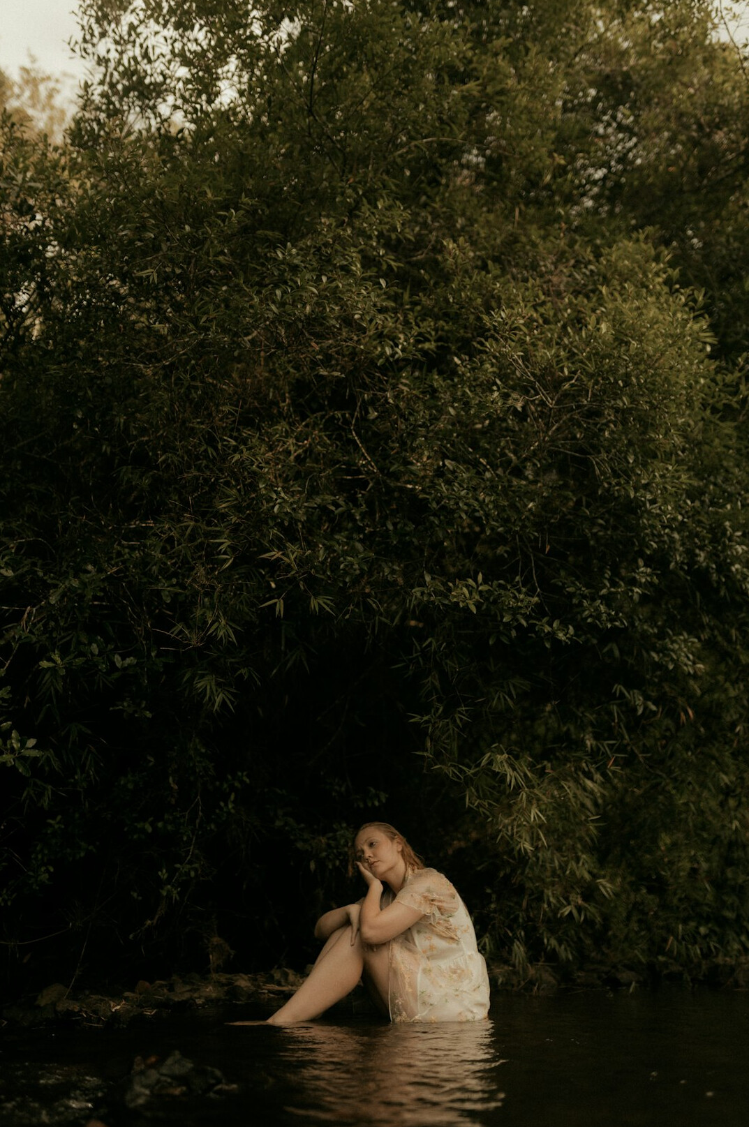 person reflecting alone in nature